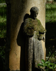 Grave stone lit by the sun.